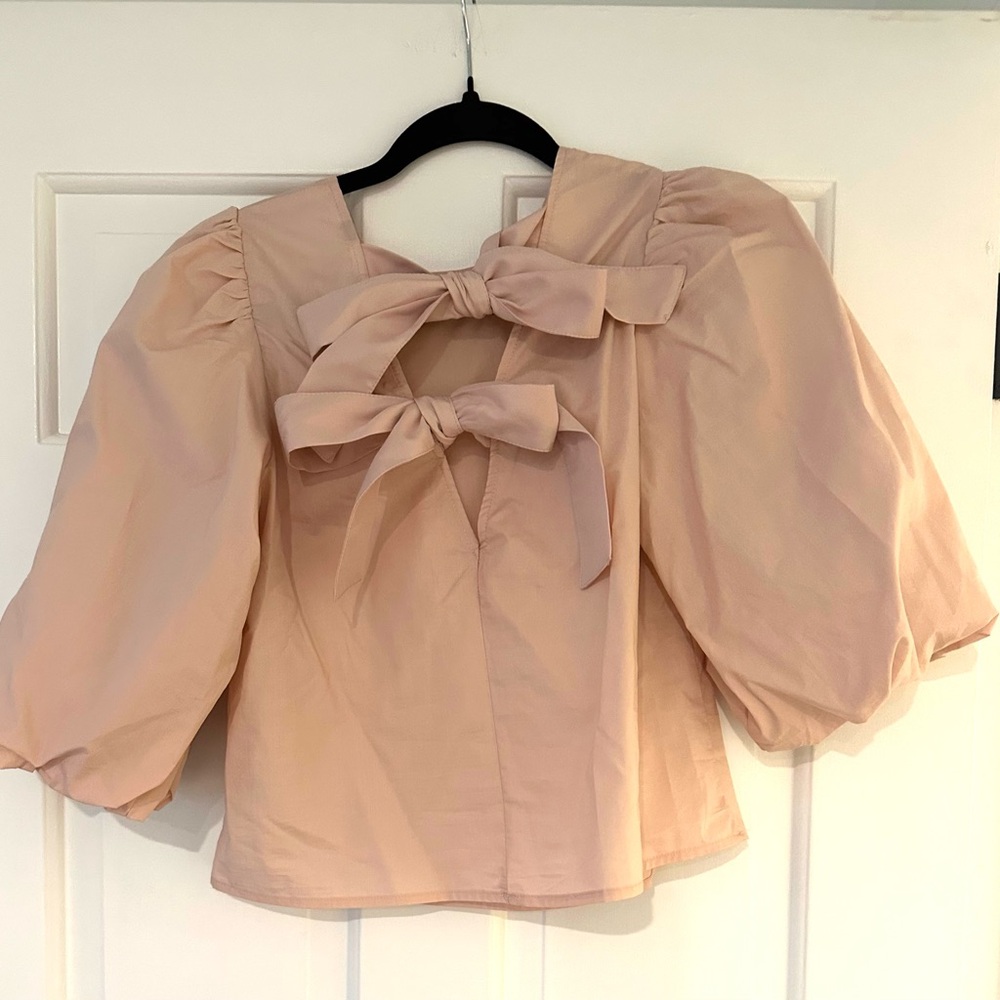 Light pink top with bows